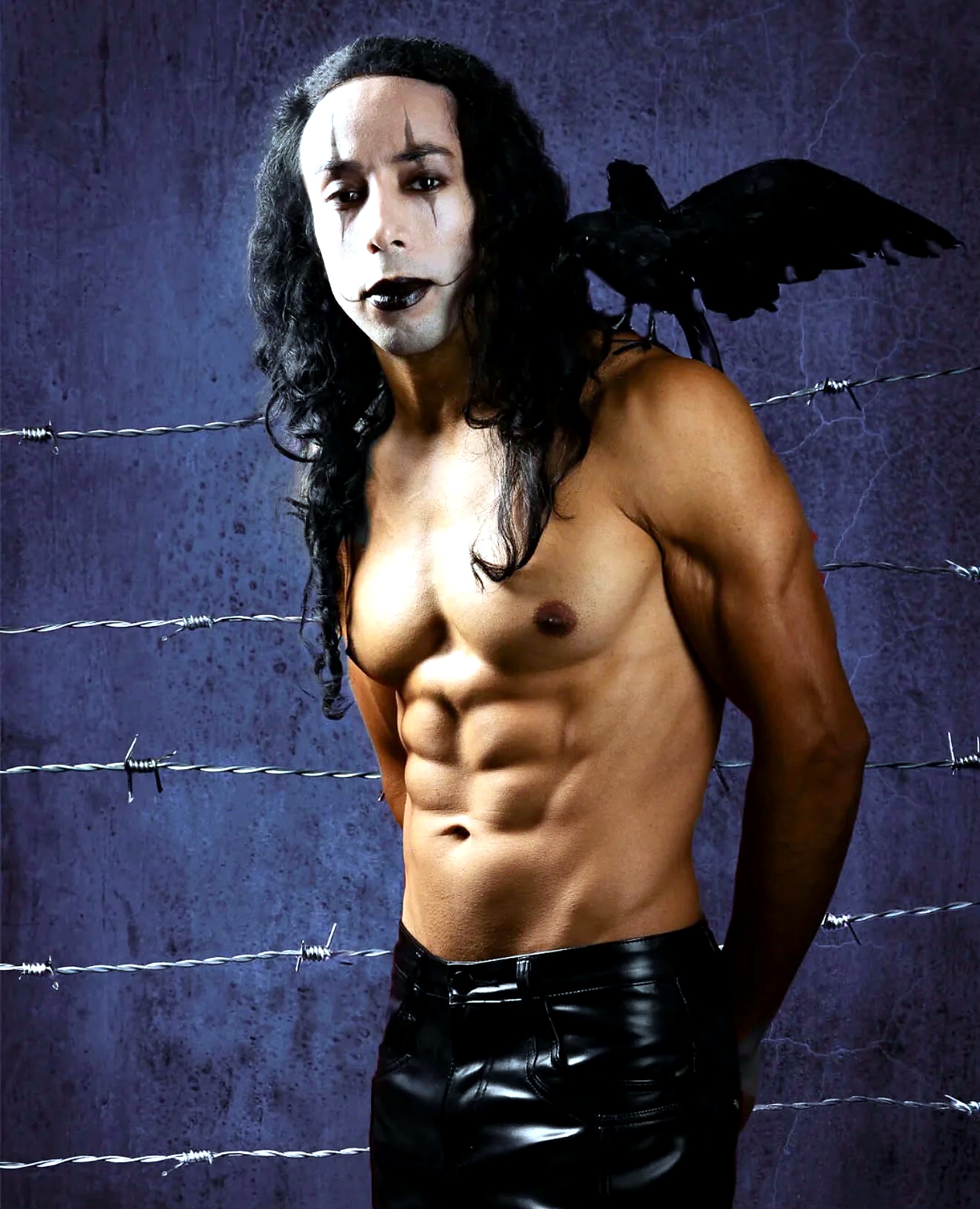 Damien with theatrical makeup and a black crow against a moody backdrop